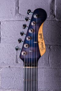 Classic-S-22726-Blue-burst-headstock-guitar-brick-background
