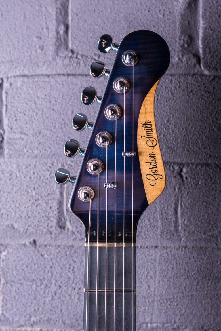 Classic-S-22726-Blue-burst-headstock-guitar-brick-background