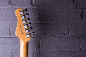 Classic-S-22726-Blue-burst-reverse-headstock-guitar-side-brick-background